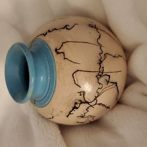 Ceramic horse hair piece.